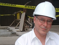 Photo of a supervisor wearing a hard hat at a construction site