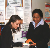 Photo of an employer with a young worker